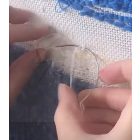 Curved sewing needle